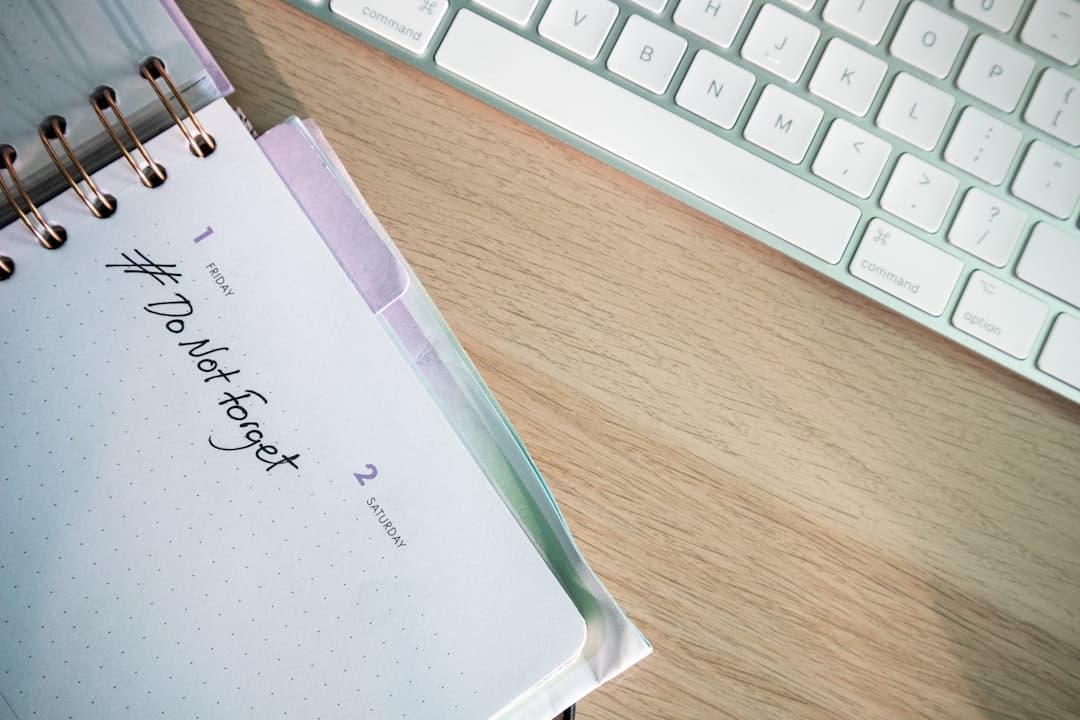 Notepad and calendar on a wooden desk for tracking dosing intervals