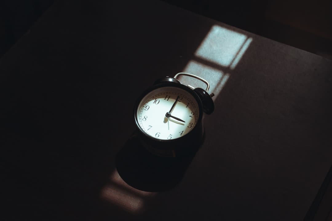 An alarm clock on a bedside table